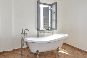 bathroom upstairs with bathtub